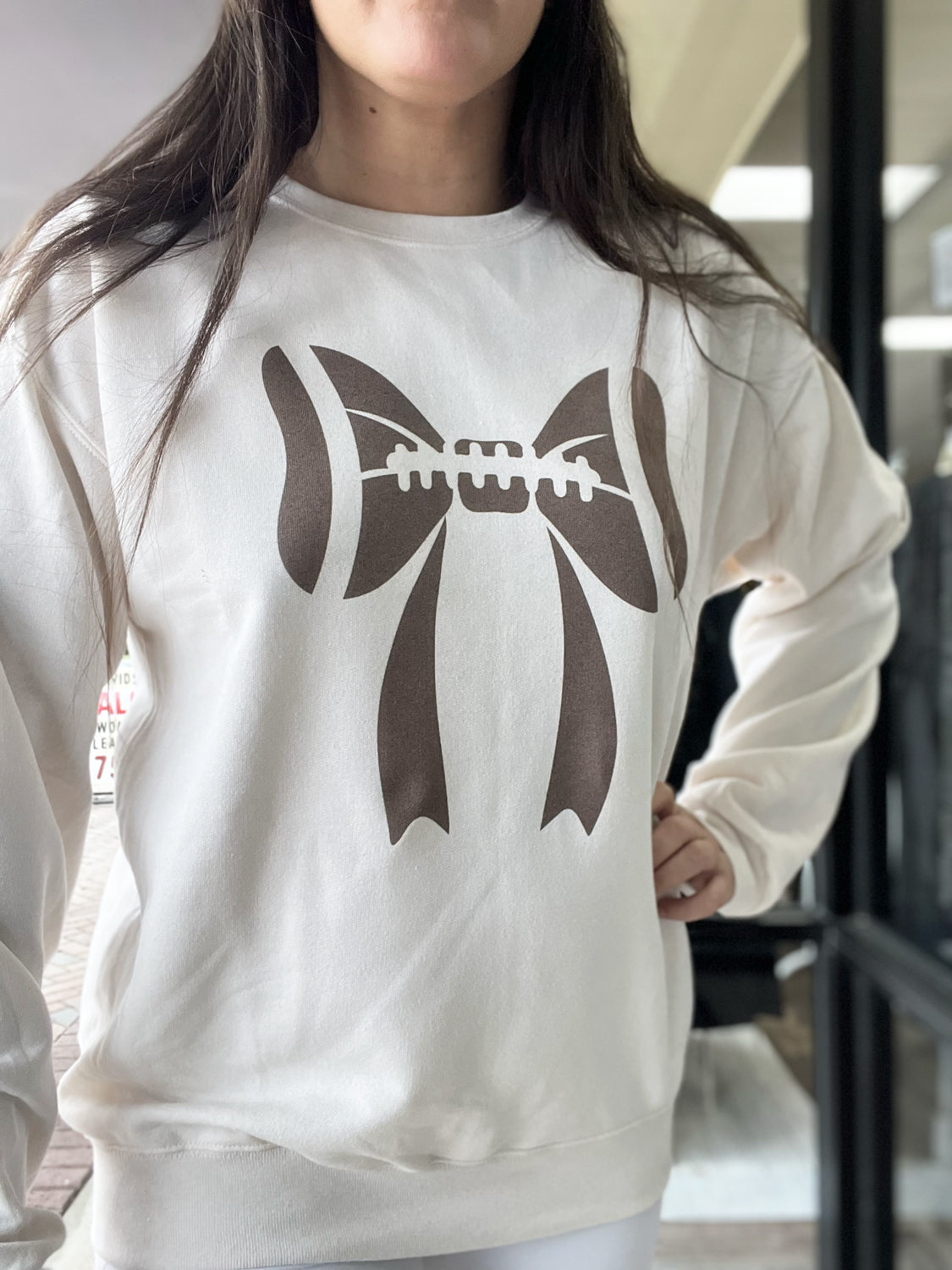 DISTRESSED VINTAGE DESIGNS Women's Sweaters Football Bow Crew || David's Clothing